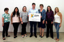 João Rafael Iensen, Diretor do DEPSD/SESP-PR e Comissão Avaliadora - da esquerda para a direita - Regina Vitório (SEED), Jéssica Barbosa (SESP), Gisele Mantovani (SINEPE), Cristina Ruaro (CONESD), Raquel Cavalheiro (ALEP) e Patrícia Moscal (SECS).